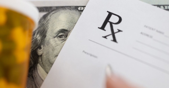 prescription drugs, dollar bill, and prescription note
