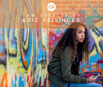 teen on phone near graffiti